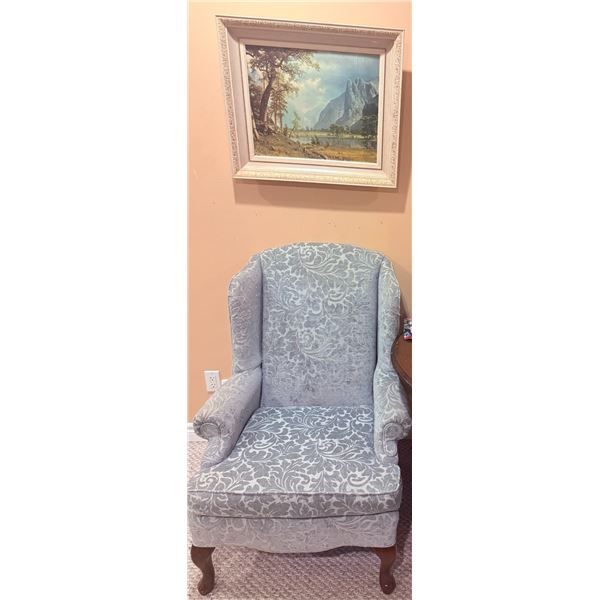 Upholstered Wingback Armchair with Damask Pattern and Framed Mountain Landscape Print