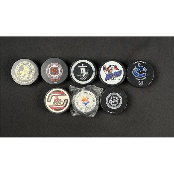 Collection of NHL and Olympic Hockey Pucks