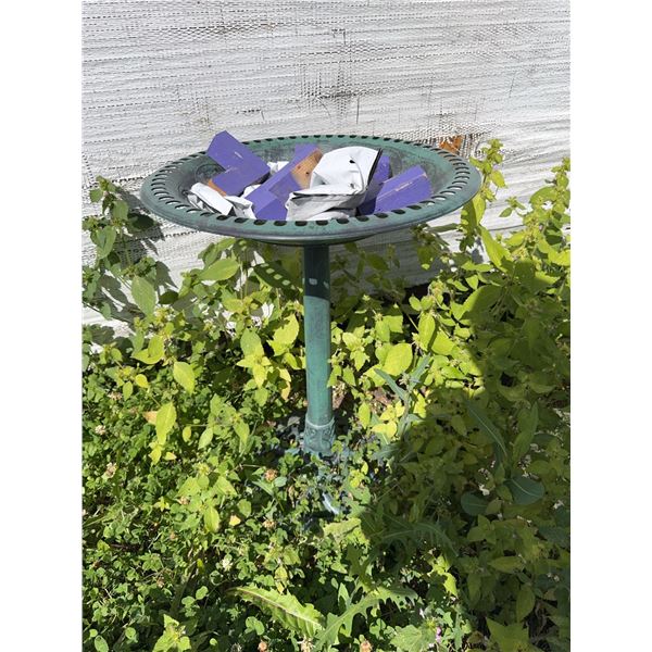 Green Metal Bird Bath With Purple and White Miscellaneous Pieces