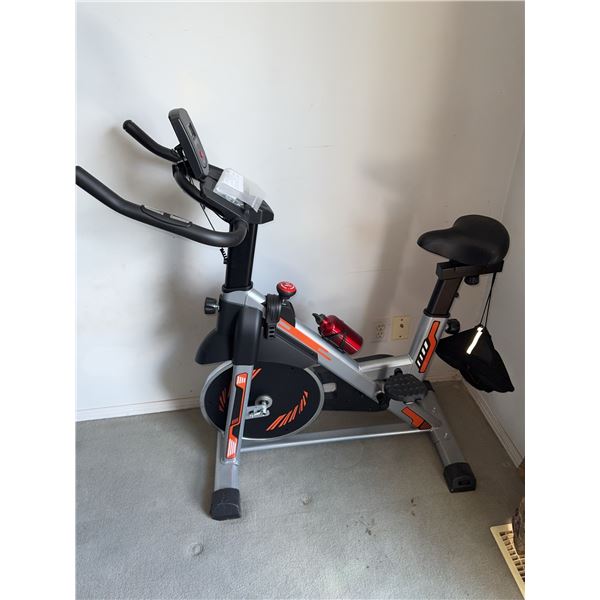 Stationary Exercise Bike With LCD Monitor And Accessories