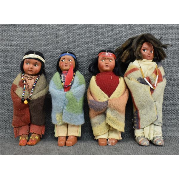 FOUR SKOOKUM DOLLS