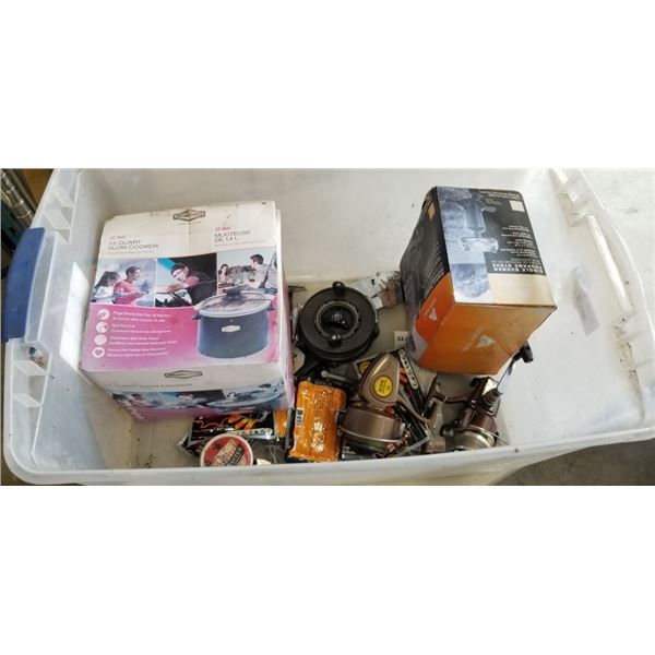 TOTE OF OUTDOOR GOODS INCLUDING CAMPING POTS, FISHING REELS, HEAT PACKS