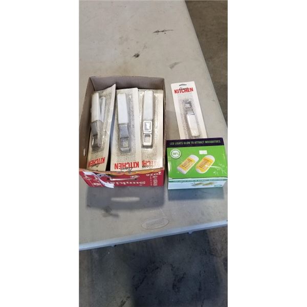 TRAY OF GARLIC PRESSES AND LED LIGHTS GLOW TO ATTRACT MOSQUITOES