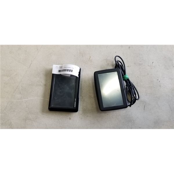 2 GPS SCREENS. 1 FROM GARMIN, ONE FROM TOMTOM