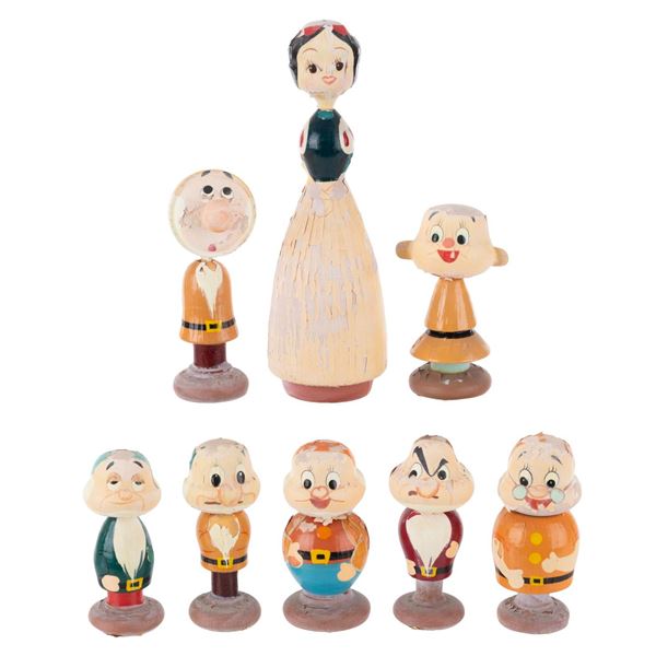 A "Snow White and the Seven Dwarfs" Wooden Figure Set.