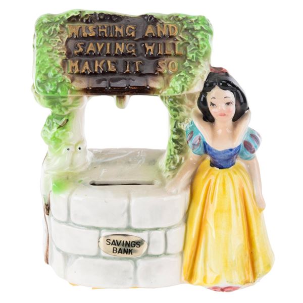 A Snow White Wishing Well Coin Bank.