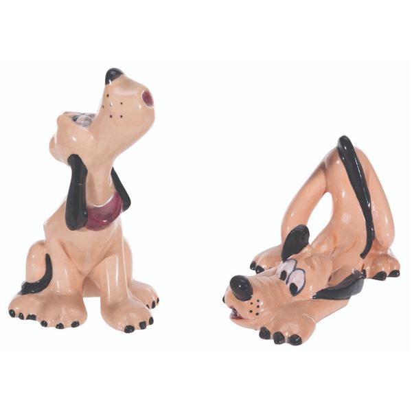 A Pair of Pluto Figurines by Brayton Laguna.