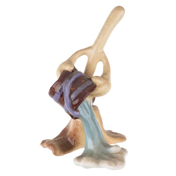 A "Fantasia" Enchanted Broom Ceramic Figurine.