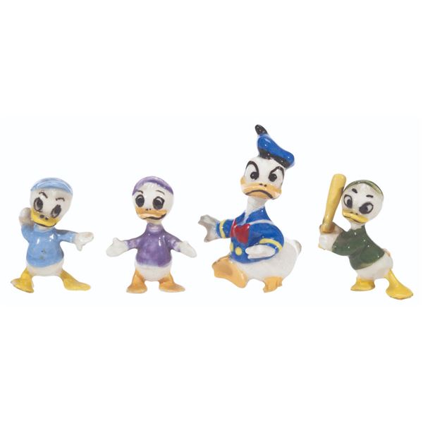 A Collection of Hagen-Renaker Donald Duck and Nephews Figurines.