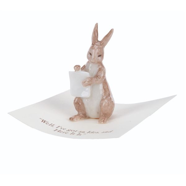A Mini "Winnie the Pooh" Rabbit Figurine.