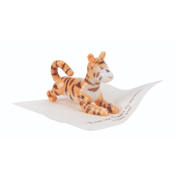 A Mini "Winnie the Pooh" Tigger Figurine.