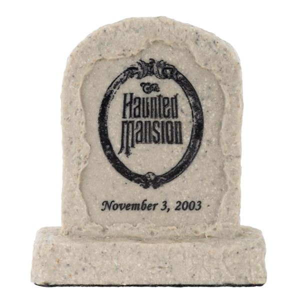A "Haunted Mansion" Event Gravestone Paperweight.
