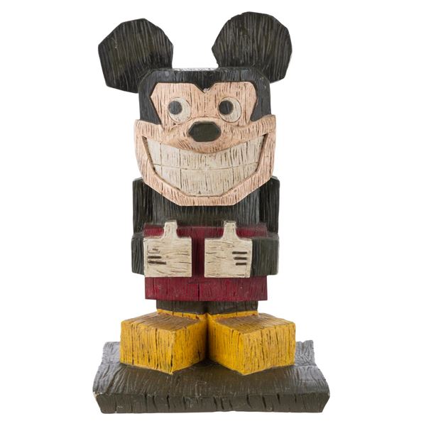 A Mickey Mouse Tiki Statue.
