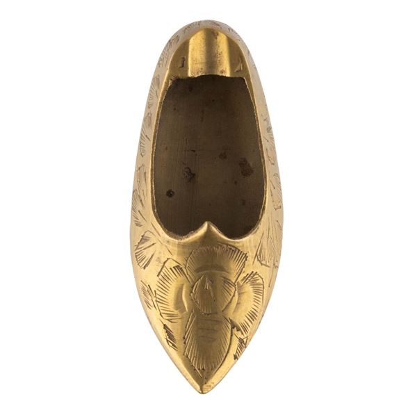 A Disneyland Souvenir Brass Shoe Ashtray.