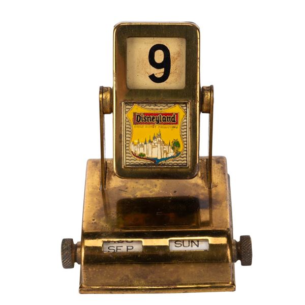 A Gold-Tone Disneyland Perpetual Calendar.