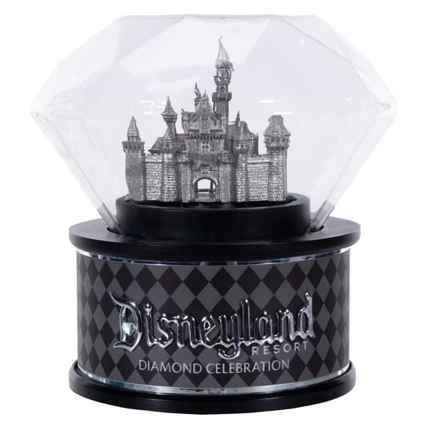 A Disneyland 60th Anniversary Rotating Castle Globe.