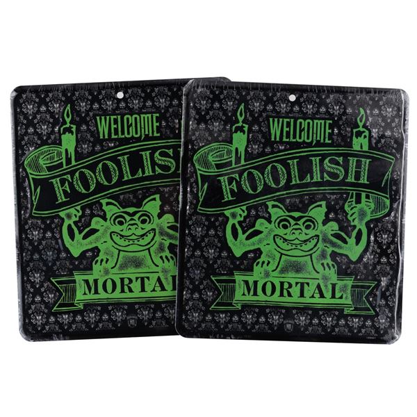 A Pair of Souvenir Haunted Mansion Tin Signs.