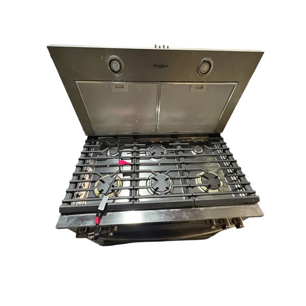 Whirlpool stainless steel gas cooktop paired with a overhead range hood featuring dual mesh filters 