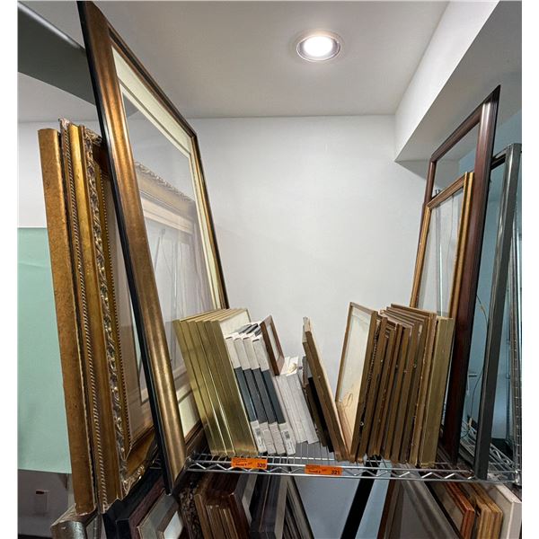 Group Of Assorted Empty Picture Frames In Various Sizes