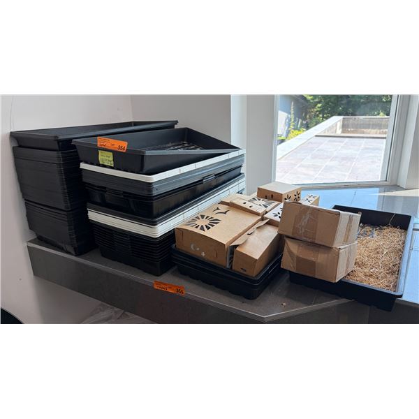 Group Of Assorted Black Plastic Seedling Trays And Decorative Cardboard Boxes With Straw Nesting Mat