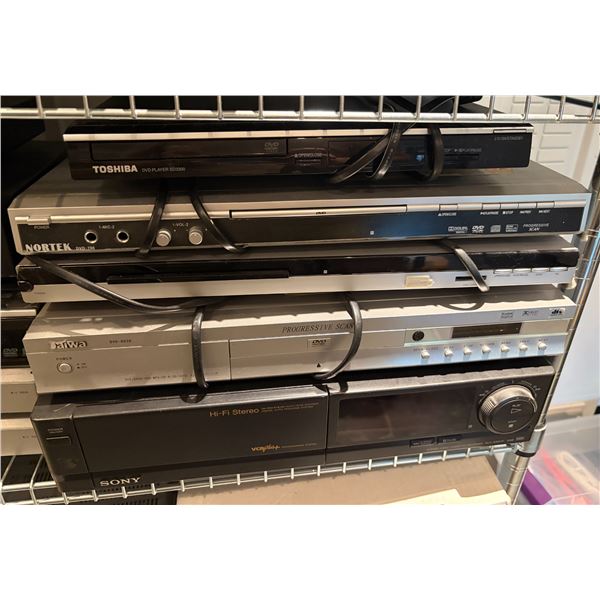 Group of Toshiba and Nortek DVD Players, Sony VCR, JVC Super VHS Player, and Motorola Dual Tuner DVR