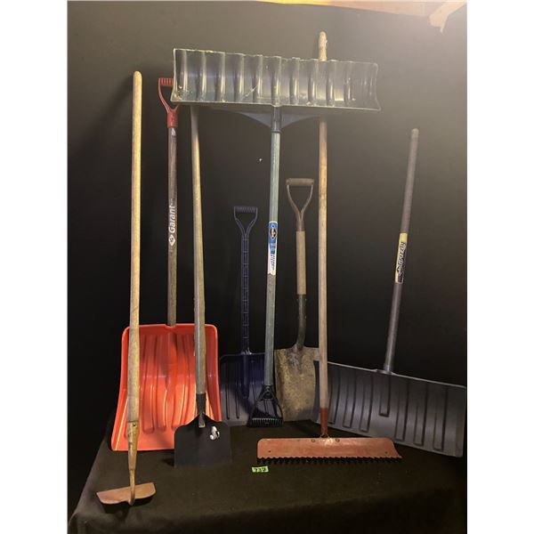 Lot of garden tools including shovels, rake and more