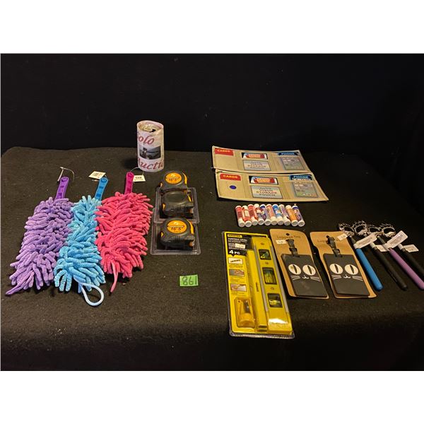 Lot of new items from gift shop including dusters, back scratchers, tape measures, lip balms and mor