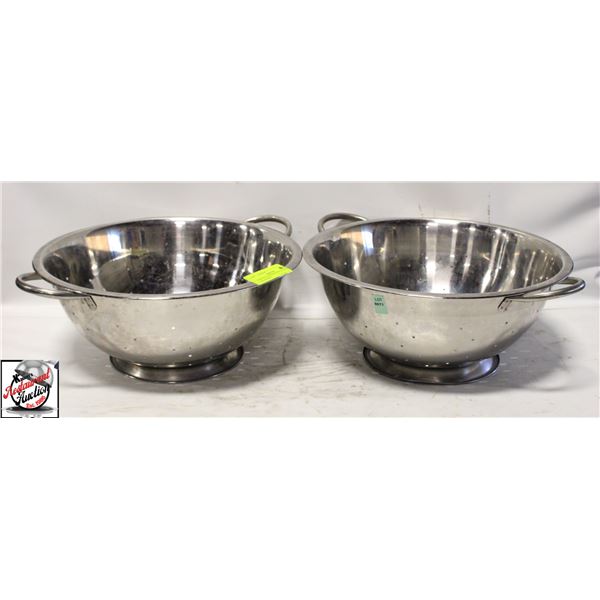 PAIR OF STAINLESS STEEL FOOTED COLANDERS