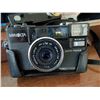 Image 6 : Olympus 35 RC Camera with Lens Cap and Minolta AF2 Camera with Case