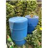 Image 1 : Garden Lot With Plastic Lawn Boy Statue, Blue Barrels, Lawn Care Products