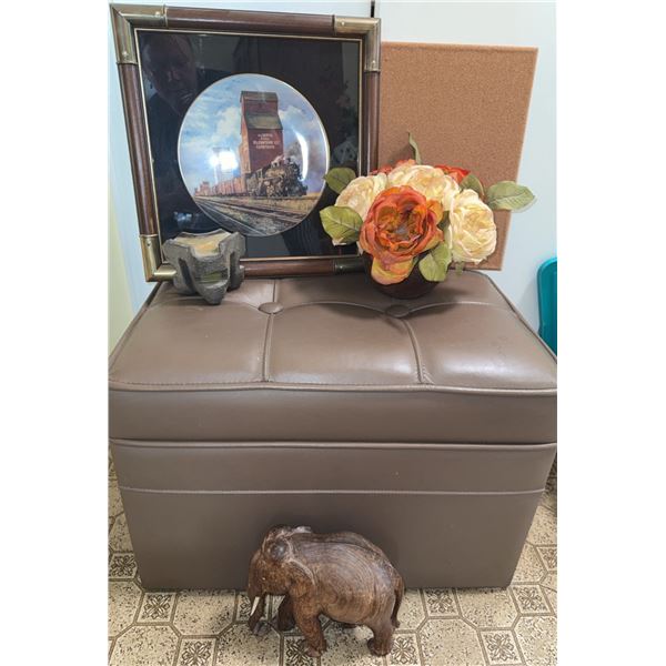 Lot: Framed Train Plate, Faux Flowers, Leather Storage Ottoman, Carved Elephant