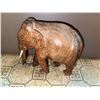 Image 3 : Lot: Framed Train Plate, Faux Flowers, Leather Storage Ottoman, Carved Elephant