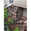 Image 1 : Stacked Covered Firewood Logs and Kindling Pile