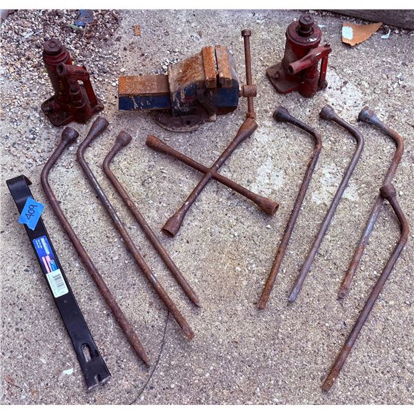 Automotive Tools Including Bottle Jacks, Tire Irons, and Bench Vise
