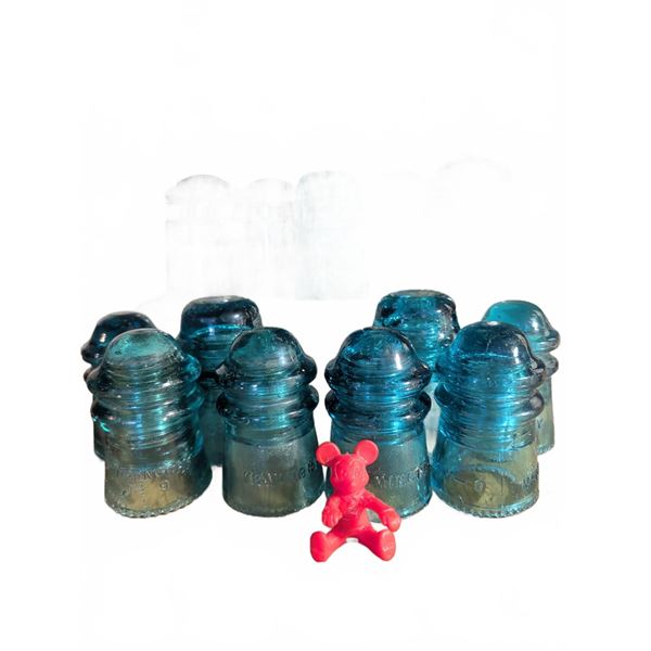 11 Hemingray Glass Insulators with Red Figurine