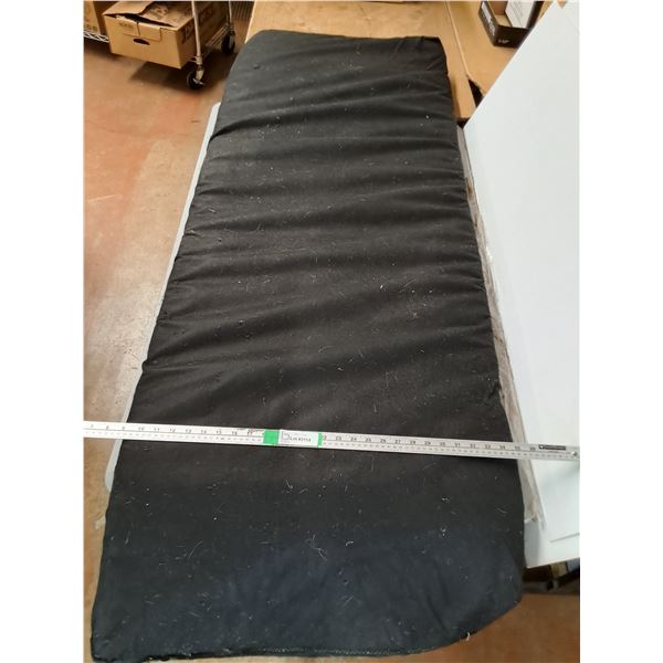 Black Padded Cushion ( animal hair on it) 72"x26" ( cannot ship)