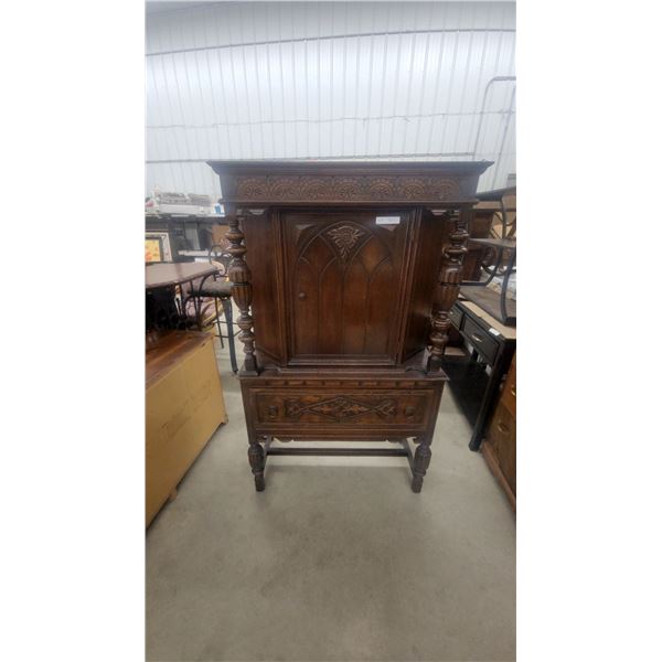 Carved Oak Corner Cabinet with Spindle Supports and Decorative Frieze 64”×37”×18”
