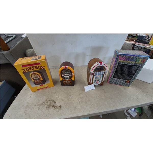 Two Jukebox Micro-Cassette Players, One Wurlitzer Micro-Cassette Jukebox, and Two Boxes. NOS