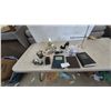 Image 1 : Adjustable Magnifying Glass, Pyramid Clock, High Heel Shoe, 3 Tape Dispensers, Calculator, 3 Books