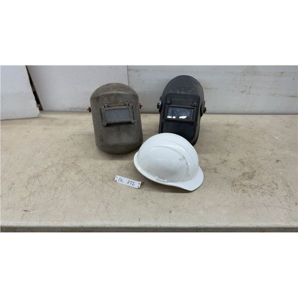 Two Welding Helmets and White Hard Hat Safety Equipment