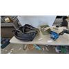 Image 1 : Prio 80 Water Pump, Rolled Blue Hose, and Green Bin with Rolled Canvas Hoses