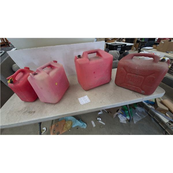 Four Red Plastic Gas Cans, One “ESSENCE” Brand