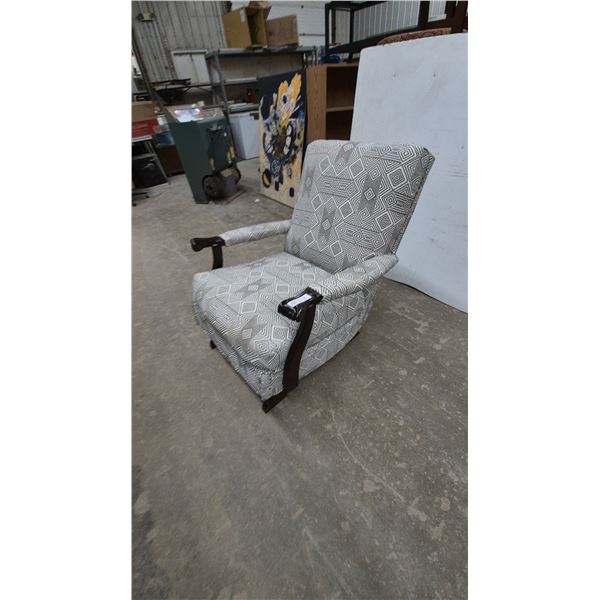 Upholstered platform rocker with Geometric Pattern and Dark Wood Arms