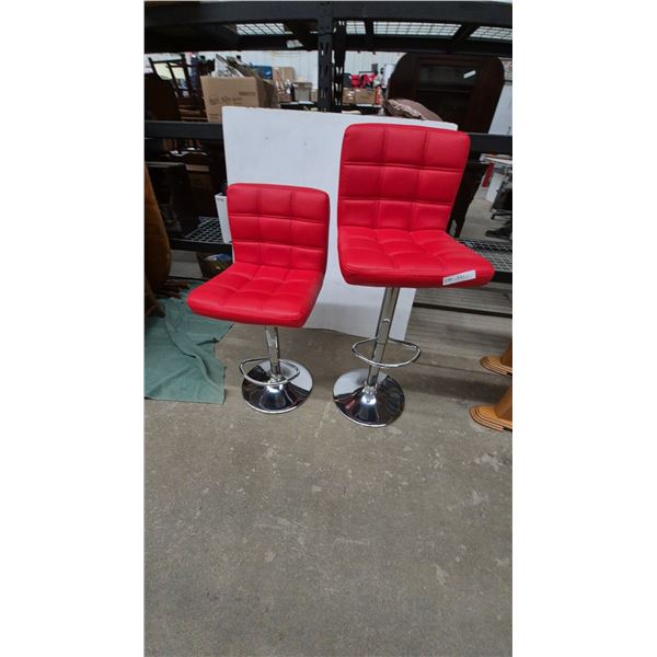 Pair of Red Tufted Adjustable Bar Stools with Chrome Bases and Footrests. Swivel