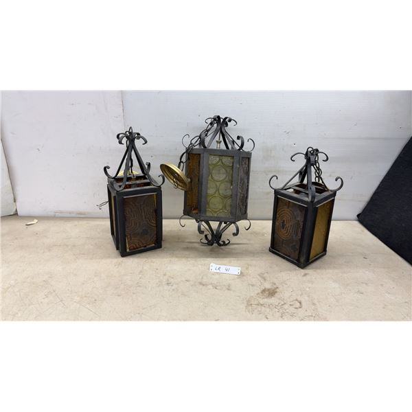 Three Wrought Iron and Stained Glass Hanging Lanterns, One with Brass Cap