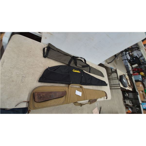 Three Gun Cases: Cabela's Black and Yellow Logo Case, Cabela's Tan Case, and Green Case