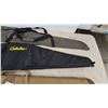 Image 5 : Three Gun Cases: Cabela's Black and Yellow Logo Case, Cabela's Tan Case, and Green Case
