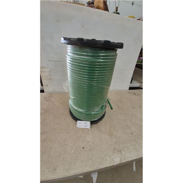 Large Spool of Green Hose, Wrapped in Plastic, with Black Top and Base