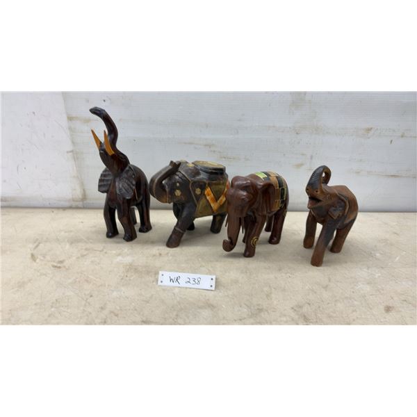 Four Carved Wooden Elephant Figures, Tallest 12”