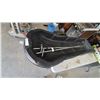 Image 2 : Black Plastic Sled with Two Ski Poles and Tow Rope